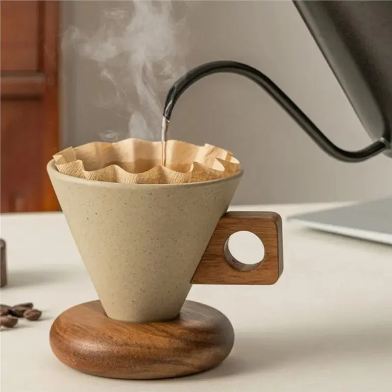 A ceramic coffee mug with a wooden base and spoon is shown, emitting steam.