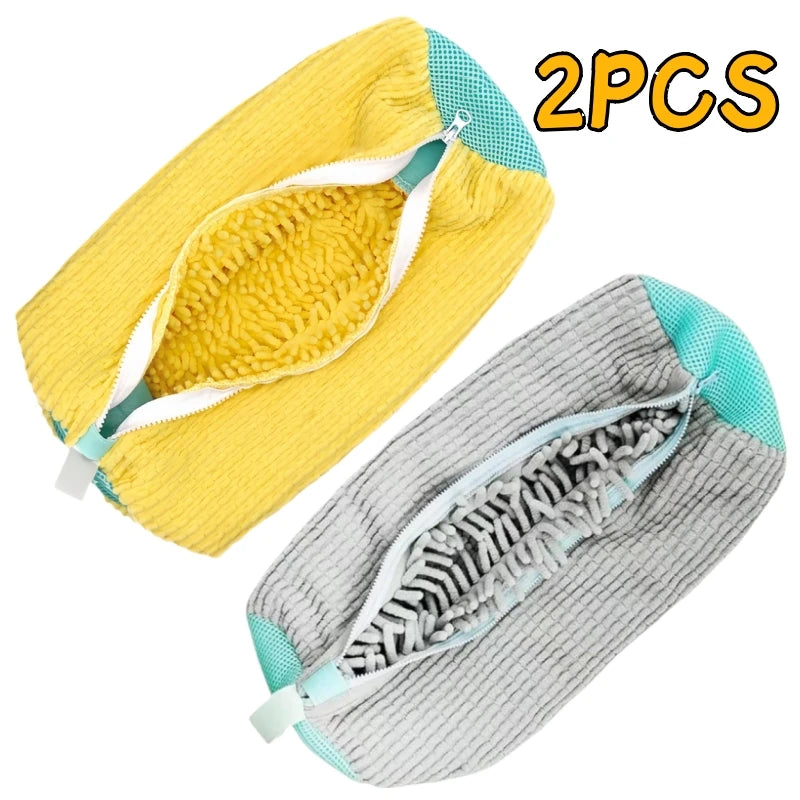 A set of two multi-use shoe cleaning bags with brushes and storage bags shown in yellow and gray.