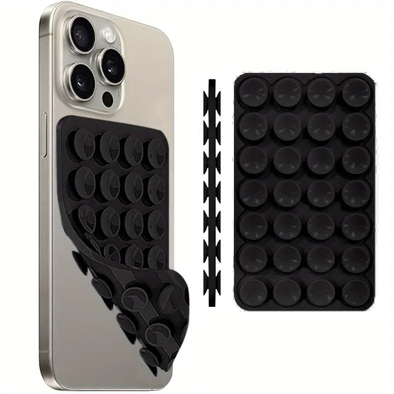 A silver smartphone with a black silicone suction cup mount and an accompanying black silicone grip
