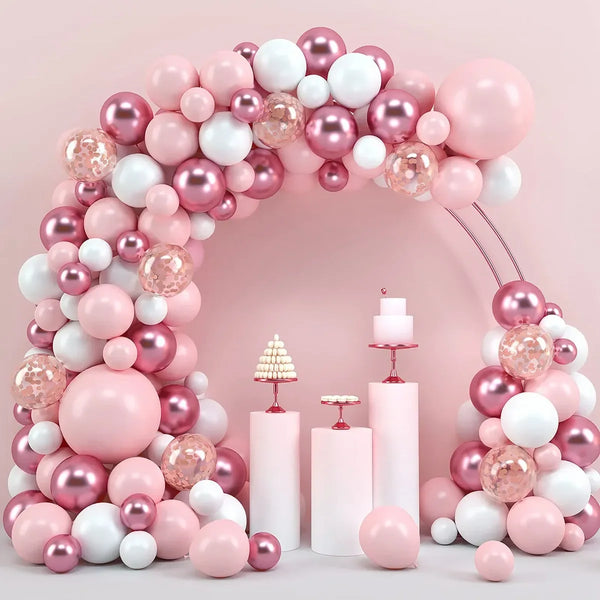 A pink and white round foil balloon garland featuring various shades of pink and white balloons arranged in an arch shape.