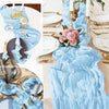 A light blue sheer fabric table runner with ruffled edges and gold accents is displayed in various angles.