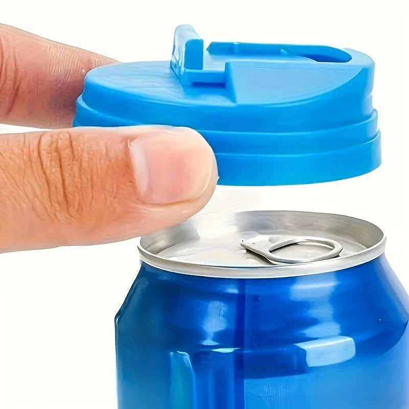 A hand is placing a blue reusable plastic soda can seal lid onto a blue aluminum soda can.