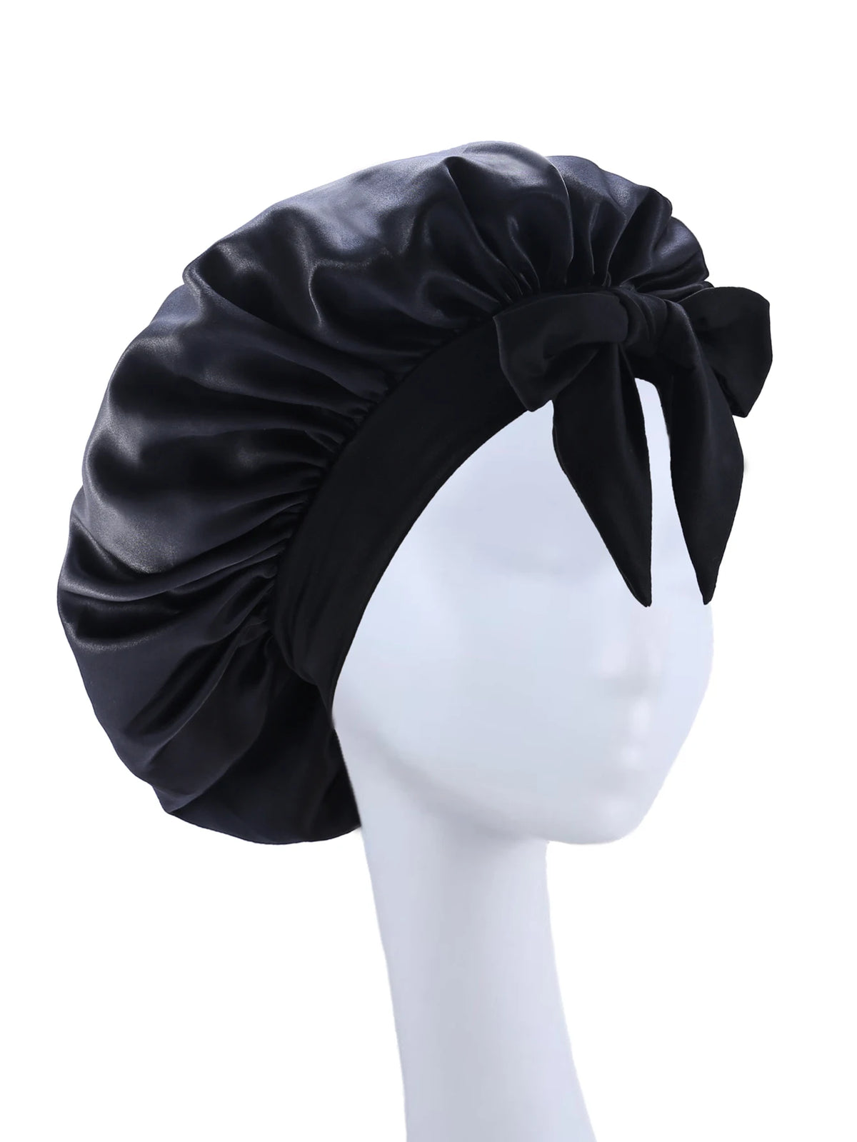 Black silky satin sleep bonnet tied in a bow displayed on a white mannequin head.