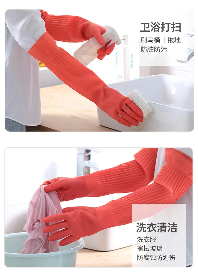 Orange silicone dishwashing gloves being used to clean dishes and cutlery.