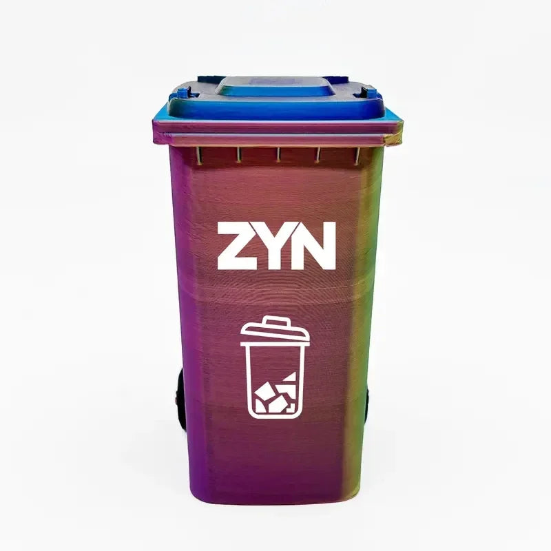 A purple mini desk organizer trash can with a blue lid and white ZYN logo on the side.
