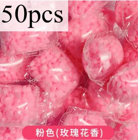 Bag of pink laundry fragrance beads for long-lasting freshness