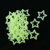 A pile of translucent lime green 3D star wall decals.