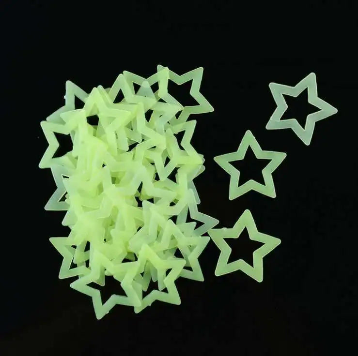 A pile of translucent lime green 3D star wall decals.