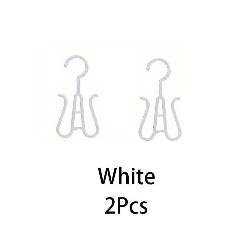 A set of two white portable plastic wig hangers.