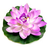 A vibrant pink artificial lotus flower blooming on a green leaf.