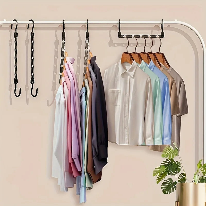 A multi-pack of plastic clothes hangers hanging on a closet rod.