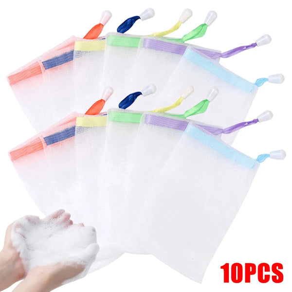 Ten clear mesh soap pouches with colored tips are displayed next to a hand holding white exfoliating foam.