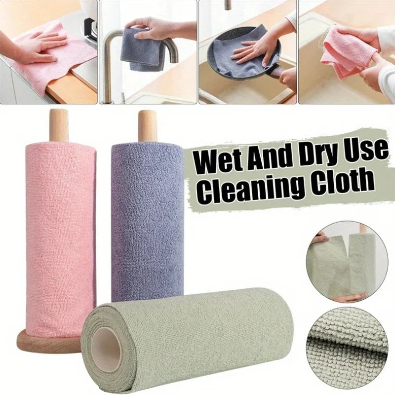 A set of reusable microfiber cleaning cloths in pink, purple, and beige colors being used for cleaning.