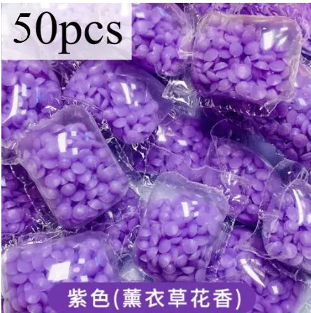 50 pieces of purple laundry fragrance beads packaged in plastic.