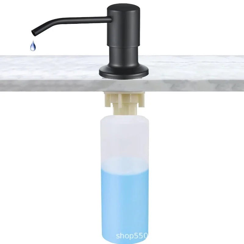 A black faucet dispensing liquid soap into a clear blue bottle on a white marble surface.