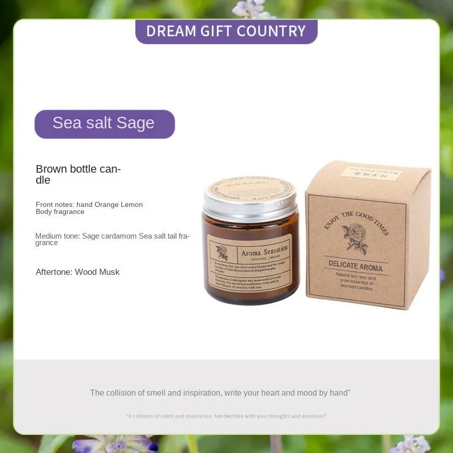A brown glass candle jar labeled Sea salt Sage with a wooden box and product description