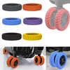 A collection of eight silicone luggage wheel protectors in various colors including black, orange, blue, purple, and yellow.