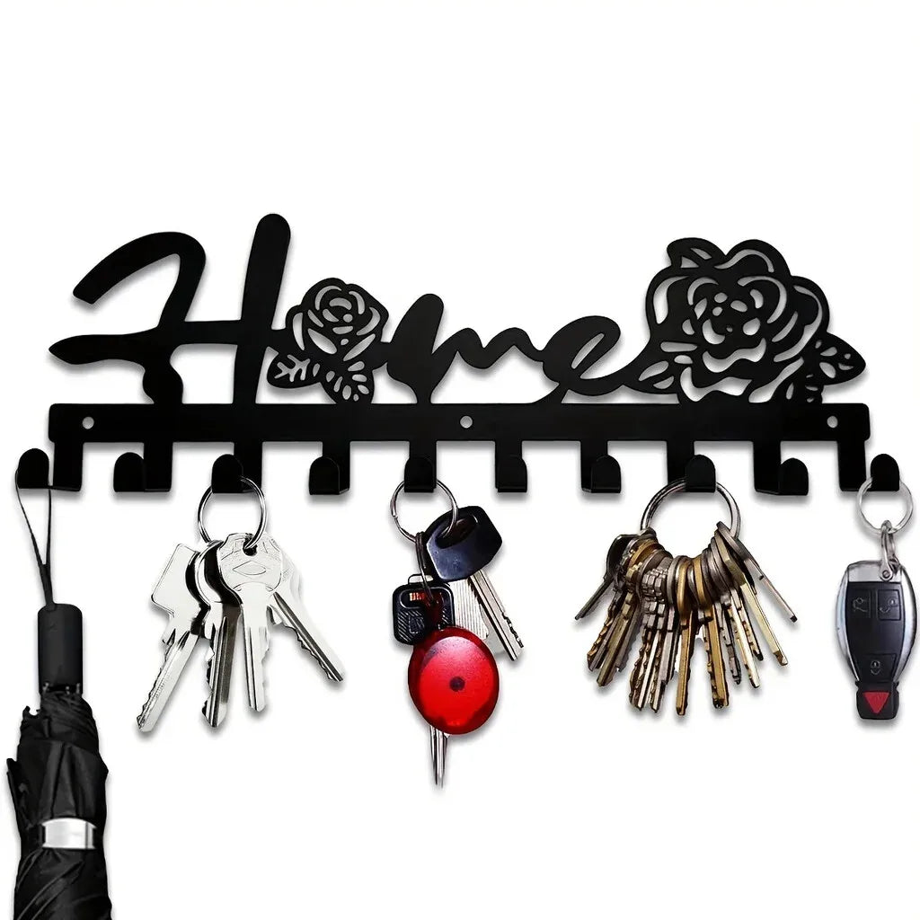 Black rustic iron key holder wall art featuring various keys and a decorative iron silhouette.