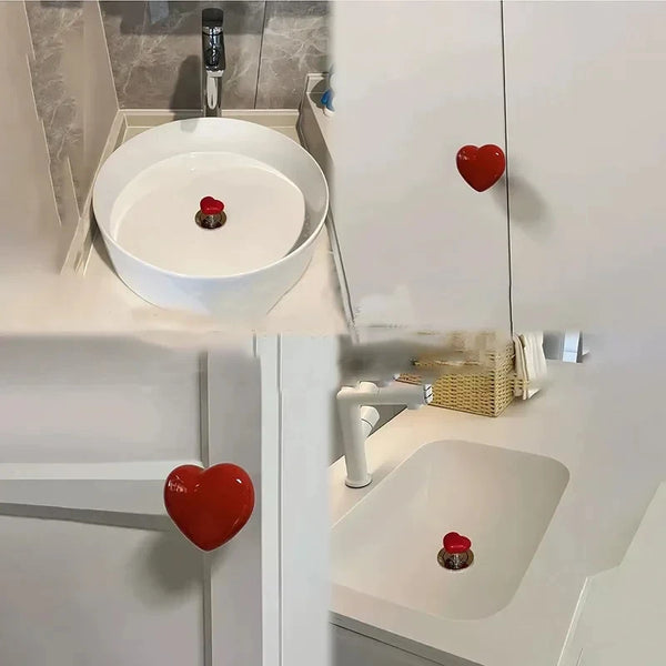 A white bathroom interior showing a toilet with red heart-shaped flush buttons.