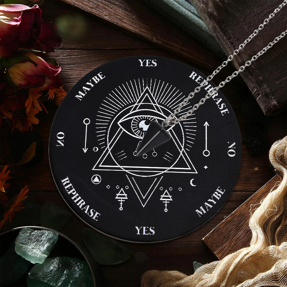 A black divination wheel with geometric symbols and a silver necklace featuring the words Yes, Maybe, and Rephrase.