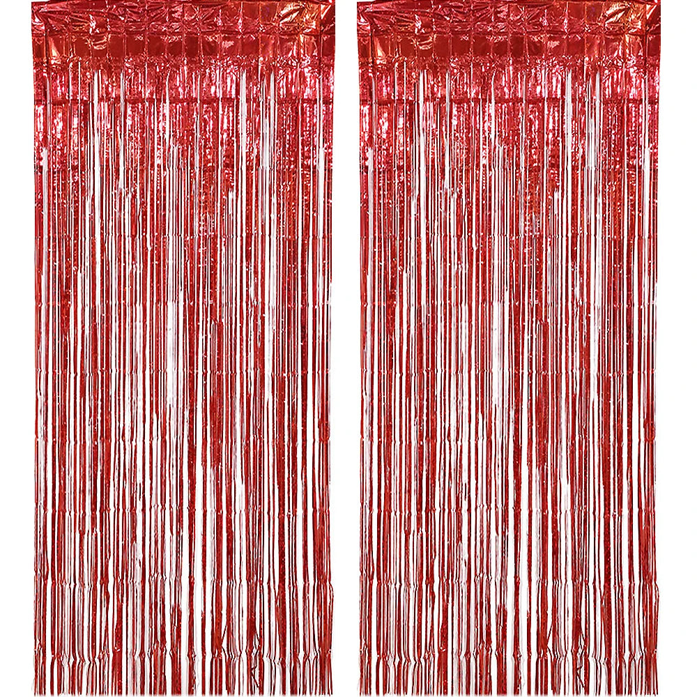 A vertical backdrop made of shimmering rose gold foil tinsel fringe curtain strands.