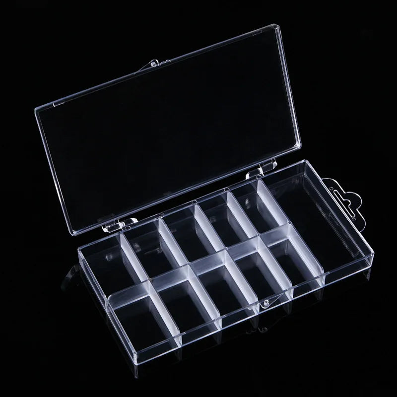 A clear plastic nail art organizer storage box with multiple compartments is shown open against a black background.