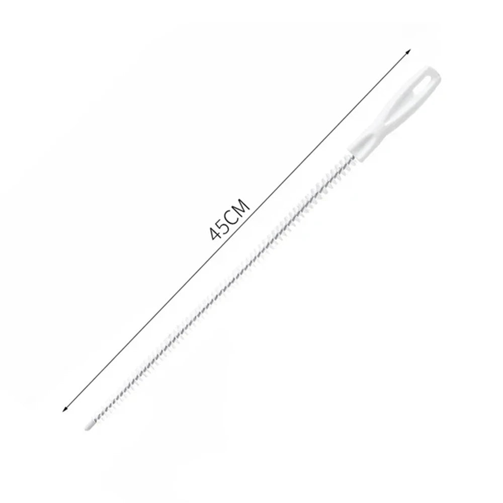 A white flexible drain cleaning brush with a long handle, shown diagonally.