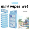 A pack of disposable mini wet wipes in a blue container with multiple wipes visible.