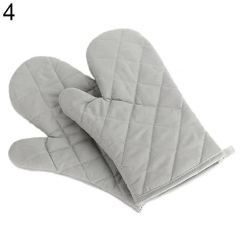 A pair of gray quilted heat resistant oven mitts shown from the side.