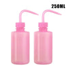 A 2-pack of pink squeeze bottles with measurement marks for tattoo solutions.