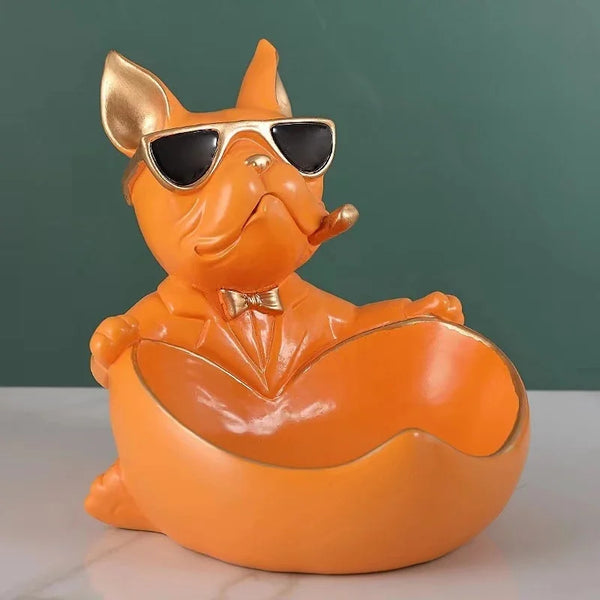 An orange French bulldog sculpture designed as a coin bank and snack holder.