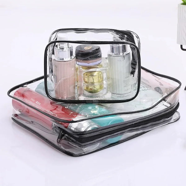 A clear plastic travel makeup organizer set containing three glass bottles of liquid cosmetics.