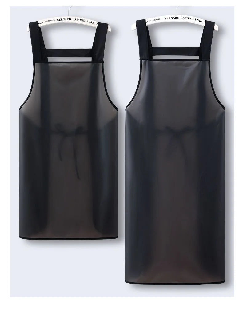 A black waterproof transparent kitchen apron hanging on a hanger.