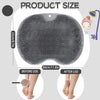A gray silicone shower foot scrubber shown before and after use on feet.