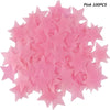 A pile of pink glow in the dark 3D star wall decals