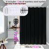 Pure black decorative shower curtain with 12 stainless steel eyelets and open ring hangers displayed in a bathroom setting.
