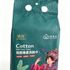 A package of green disposable cotton face towels featuring an illustration of a woman in traditional attire.