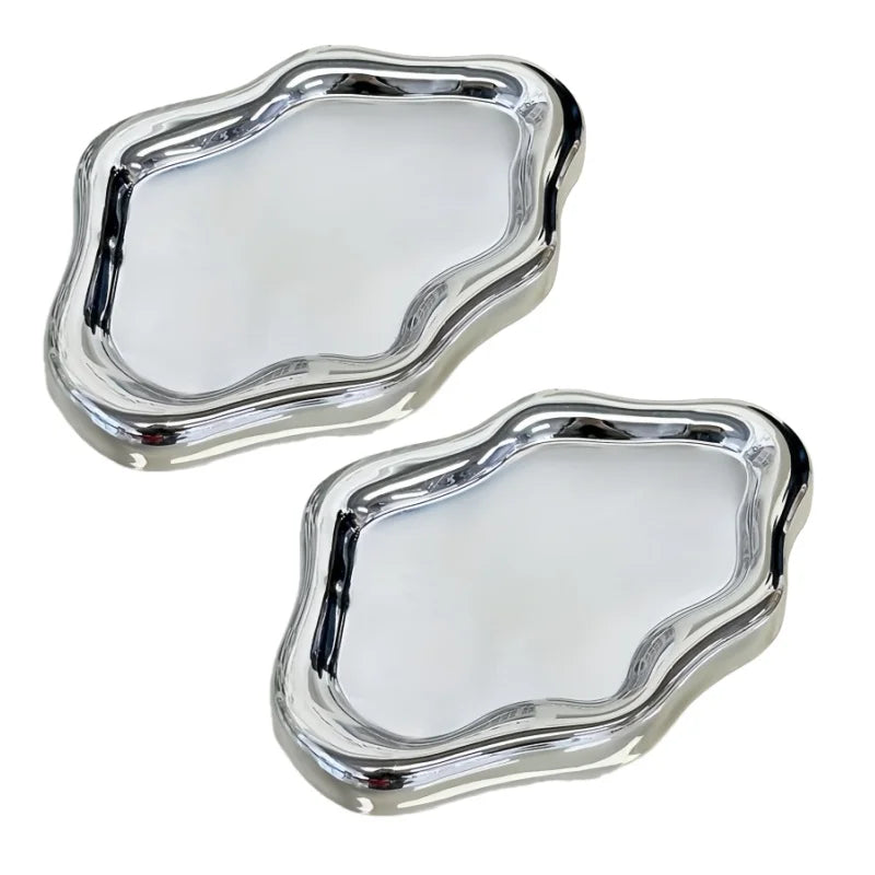 A silver cloud-shaped jewelry organizer tray with a slightly irregular, organic outline.