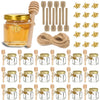 A set of glass honey jars with wooden dippers and lids for gifting