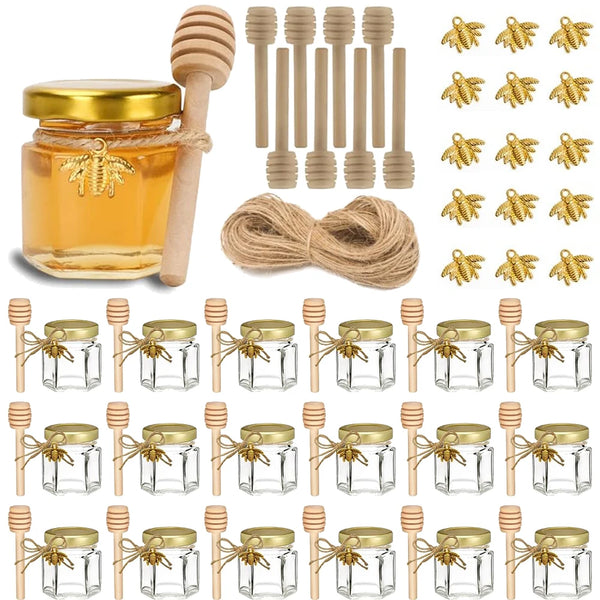 A set of glass honey jars with wooden dippers and lids for gifting