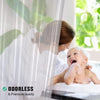 A woman is holding a baby in a shower setting, demonstrating an odorless and premium quality clear waterproof shower curtain 