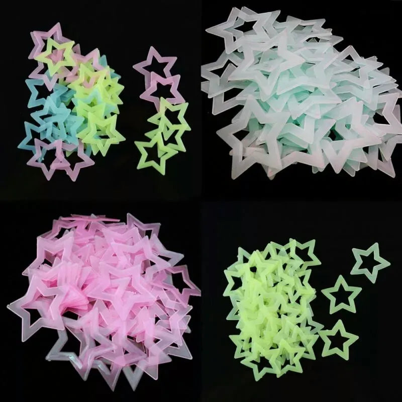 A collection of glow in the dark 3D star wall decals in pink, teal, and lime green.