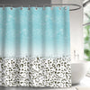 Light blue and teal abstract geometric line shower curtain hanging on a rod.