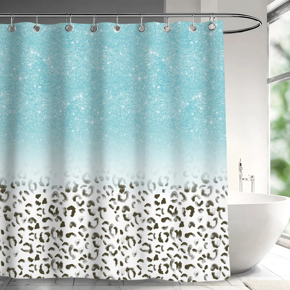 Light blue and teal abstract geometric line shower curtain hanging on a rod.