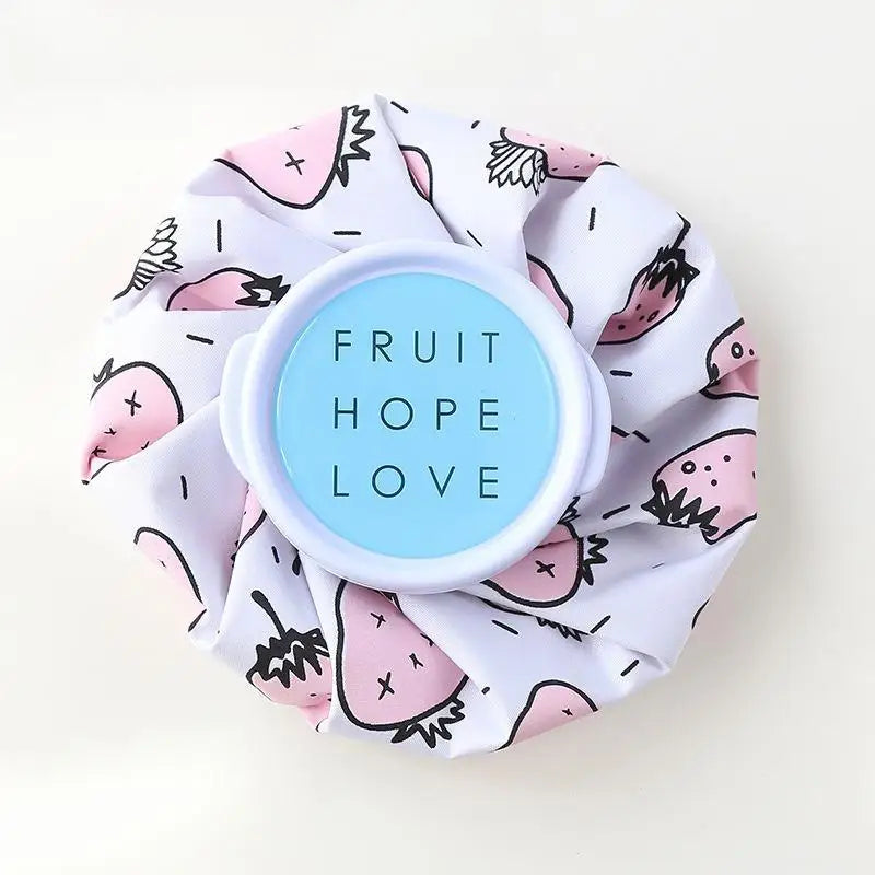 A reusable fabric pack with a pink fruit pattern and a blue circle labeled Fruit Hope Love
