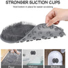 A gray wall mounted shower foot scrubber tool shown in use on a bathroom surface.