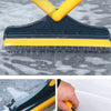 A yellow and black 2-in-1 floor scrub brush is shown cleaning a wet, speckled surface.