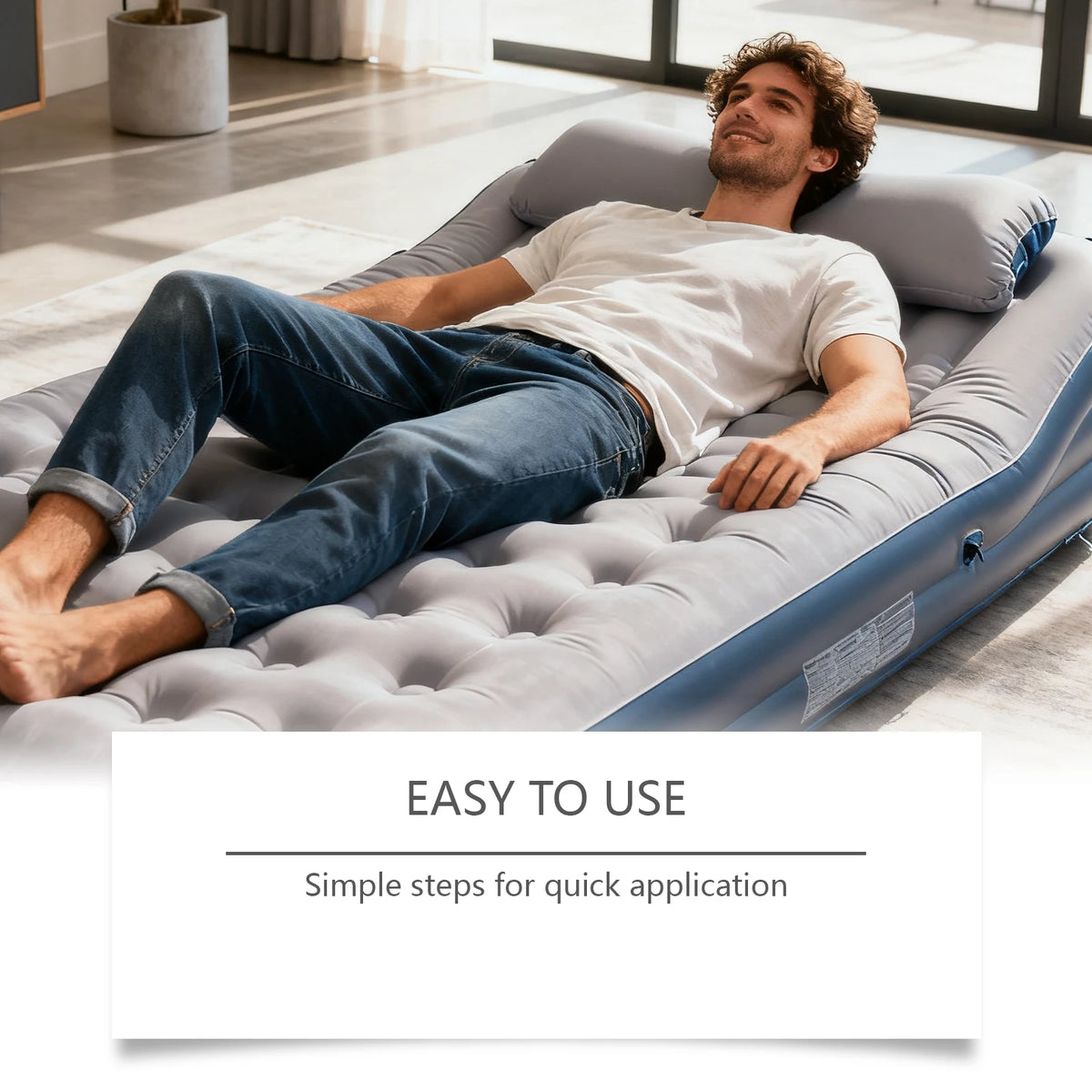 A man relaxing on a gray inflatable lounger indoors, demonstrating the easy to use repair kit.