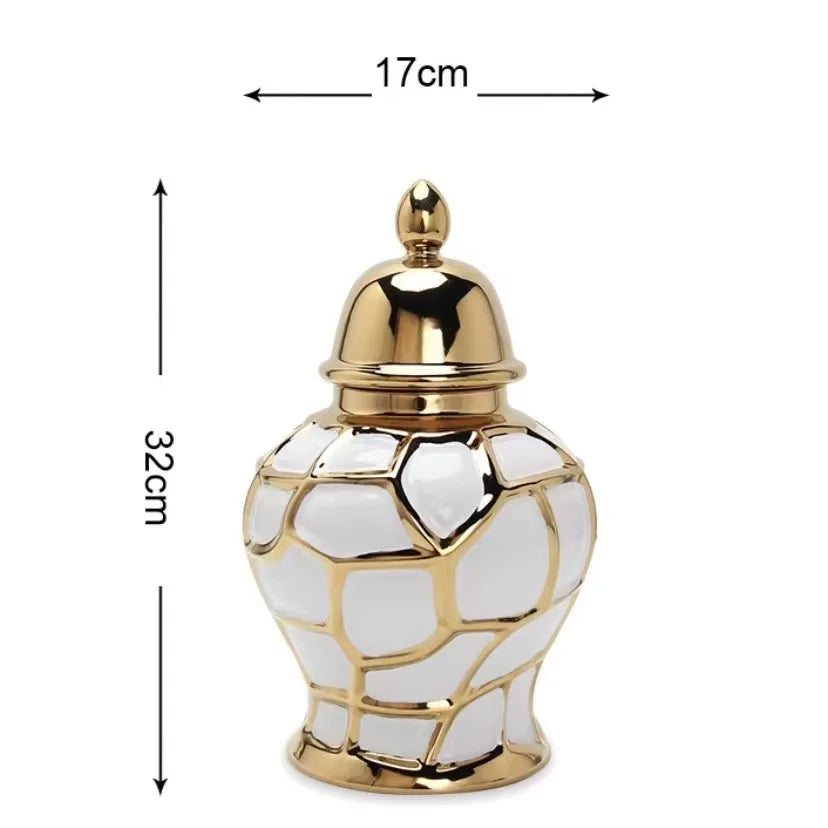A golden ceramic flower vase with a textured, faceted design and a lid.