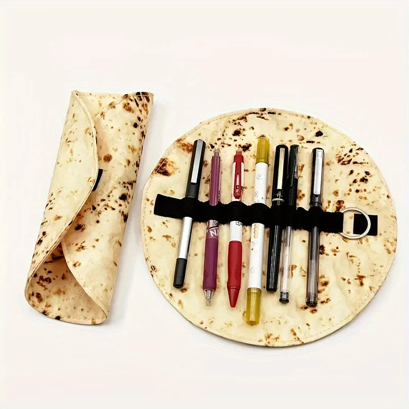 A canvas pencil pouch shaped like a burrito, holding various colored pencils on a round tortilla.